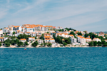 The city of Rogoznica in Croatia. Villas, hotels and houses on the Adriatic coast, azure blue water and sandy beaches.