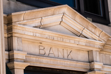 Stone facade with the word Bank engraved on it