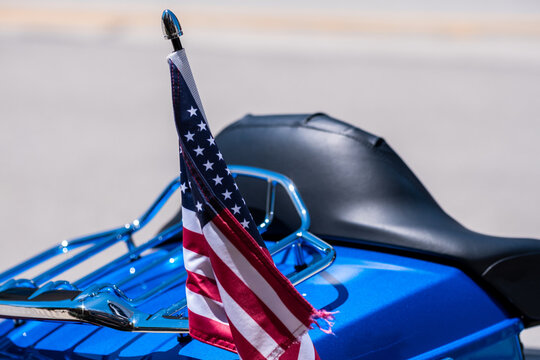 US Flag On The Back Of A Blue Motorcycle