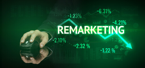 male hand holding wireless peripheral with REMARKETING inscription, modern business concept