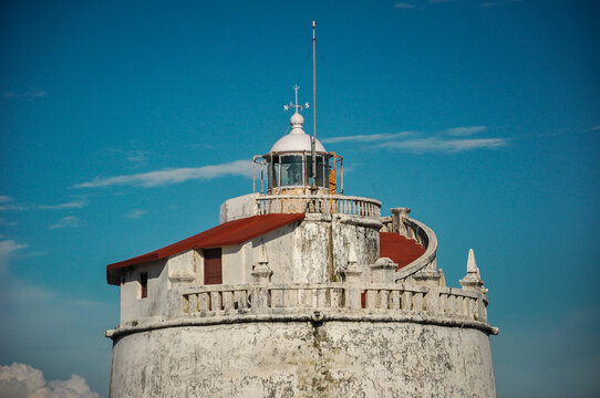 old lighthouse light in sky near sea water lighthouse tower single in india goa world