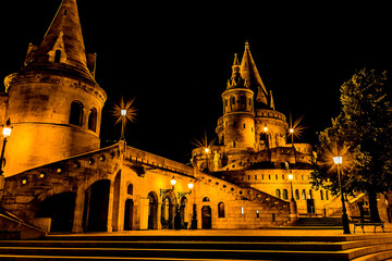The conical towers of the Fisherman's Bastion in  Budapest at night during the summertime