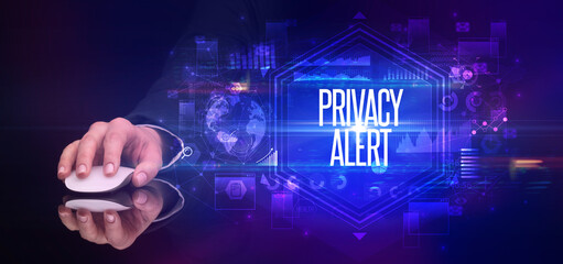 hand holding wireless peripheral with PRIVACY ALERT inscription, cyber security concept