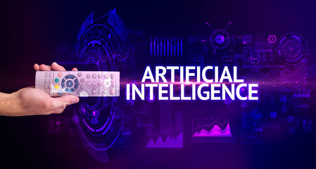 hand holding wireless peripheral with ARTIFICIAL INTELLIGENCE inscription, modern technology concept
