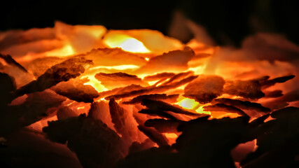 burning in the fire with hot red orange yellow coal and rice burning background, heat energy