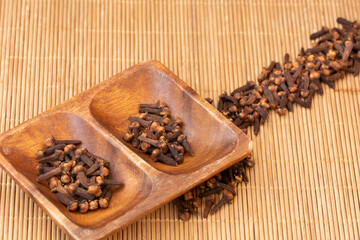 carnations in basket on wooden background