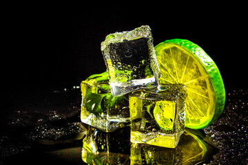 three pieces of ice and a slice of lemon on a black background
