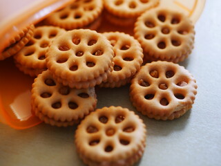 Shortbread cookies in a plastic container on the table. vertical view from above
