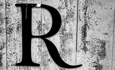 alphabet r in a wooded texture background