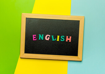 Word Learning english made with wooden letters over the wooden board