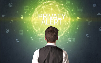 Rear view of a businessman with PRIVACY ALERT inscription, online security concept
