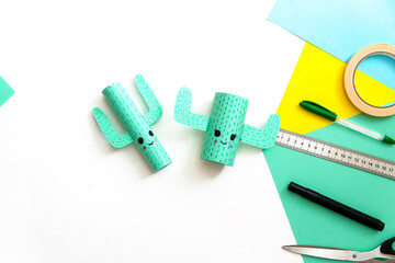 Step-by-step lesson: how to make a cute cactus from a toilet sleeve and colored paper. Using scissors and glue. Step 9. Interesting crafts with children.