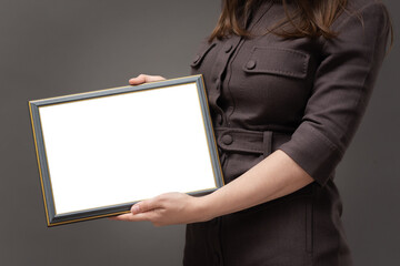 Business woman with a blank diploma certificate mock up in hands close up.