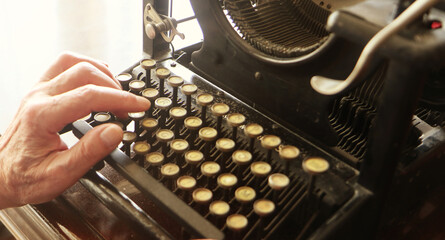 writing with an old typewriter