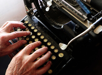 writing with an old typewriter