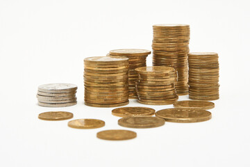 Stacks of coins on a white background.