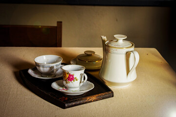 cup of coffee and teapot