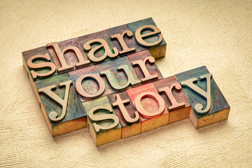 share your story word abstract in vintage letterpress wood type stained by color inks, business,...