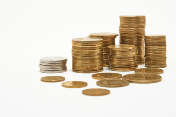 Stacks of coins on a white background.