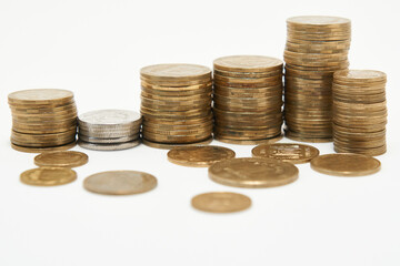 Stacks of coins on a white background.