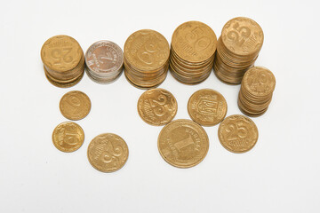 Stacks of coins on a white background.