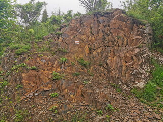 Marking the mountain trail on a large rock.