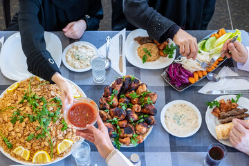 happy muslim family eating togther