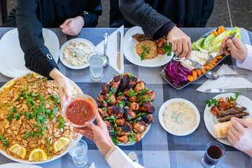 happy muslim family eating togther