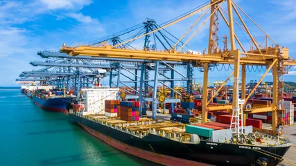 Fotobehang Aerial view container cargo ship, import export commerce global business trade logistic and transportation of International by container cargo ship boat, Freight shipping maritime sea port terminal. © Kalyakan