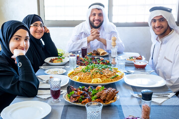 Happy arabic muslim family enjoying the food togther in ramadan