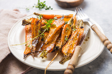 Still life of roasted baby carrots with a herb and honey glaze