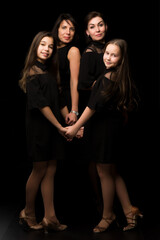 Young, Beautiful mothers with two charming daughters. Studio por