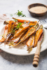 Still life of roasted baby carrots with a herb and honey glaze