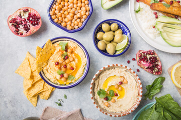 Fototapeta na wymiar Directly above shot of Hummus or humus In bowl on table. Vegan plant based food