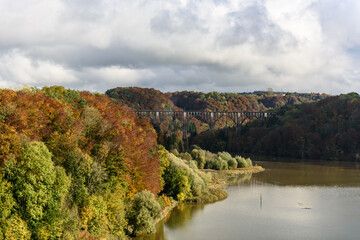 Fototapeta na wymiar autumn landscape with lake and clouds