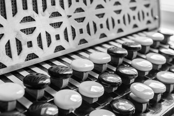Russian musical instrument. Black and white buttons on the button accordion. Chromatic hand...