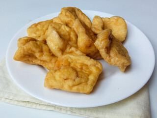 Flat and square version of Tahu Pong, or hollow tofu. Mostly used for Tahu Petis, a snack from Semarang Indonesia. Isolated in white background