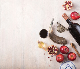 Rosh hashanah - jewish New Year holiday concept. Traditional symbols: Honey jar and fresh apples...