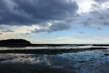The sea view without water and the clouds are raining