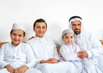 Fototapeta na wymiar happy arabic family sitting together,