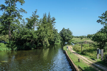 Walkers beside  The River Wey Near Triggs Lock Guildford Surrey