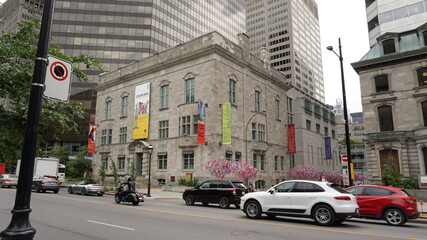 Montreal, QC/Canada - 6/26/2020: a combination of old and modern architecture at the same scene, the historical building of McCord museum with a background of a modern building of McGill univeristy.