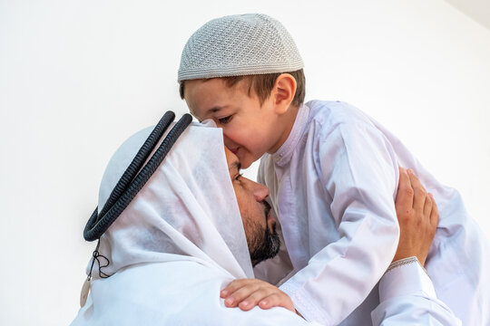 Arabic muslim son kiising his father forehead