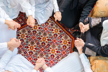 Happy Arabic family holding hands during Ramadan