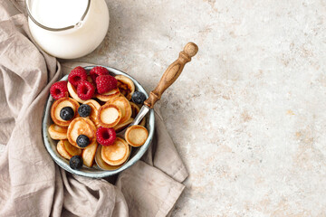 Cereal pancakes with raspberries, mint and blueberries.Trendy food.Tasty breakfast