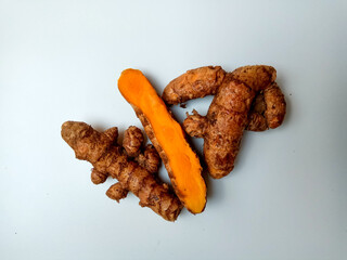 Turmeric or Curcuma longa rhizomes, isolated in white background