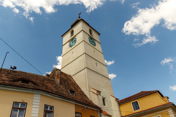 SIBIU, ROMANIA - Circa 2020: Old medieval town with cloudy blue sky. Beautiful tourist spot in eastern central Europe. Famous Tower of Council in Sibiu Romania
