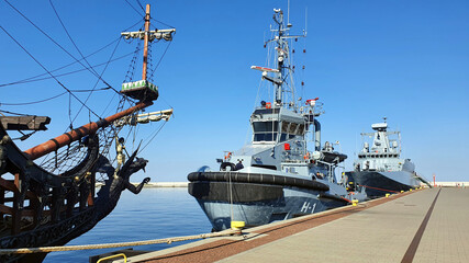 Polish patrol ship ORP Ślązak and tug Gniewko moored at the quay in the port of Gdynia, Poland