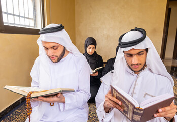 Happy msulim family reading Quran togther