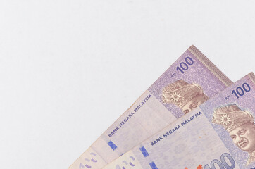 Malaysia Currency (MYR) Ringgit Malaysia bank note. Close up on money showing the first of Malaysian King on Rm100 notes.